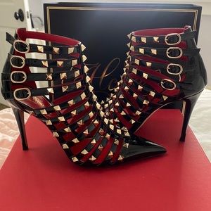 Valentino paten leather/gold rock stud heels.